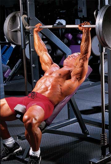 START Position yourself on an incline bench set at about 45 degrees so that - photo 10