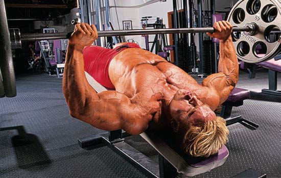 START Lie back on a bench set to about a 30-40-degree decline Grasp the - photo 9