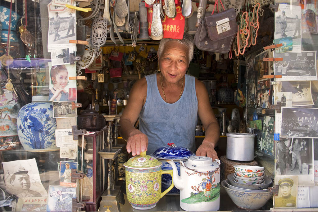 A shop owner at Dongtai Road Antique Market GREG ELMS GETTY IMAGES By Damian - photo 7