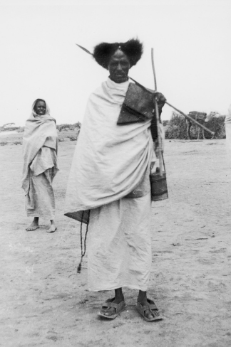 A wardad mullah Prayer mat over shoulder and military water bottle at hip - photo 10