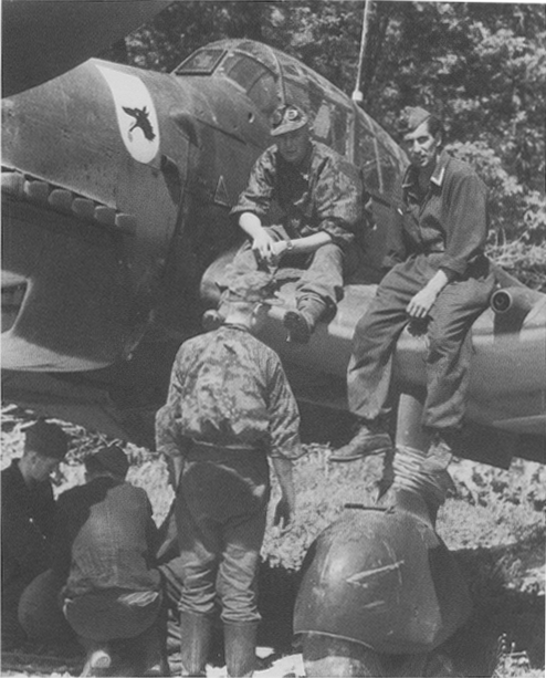 While armourers work on the main bomb beneath the fuselage other members of - photo 2