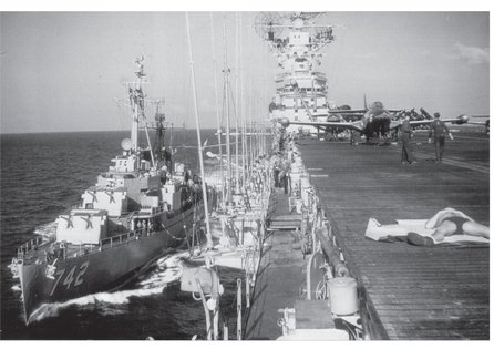 A destroyer pulls along side the USS Princeton off the coast of North Korea in - photo 2