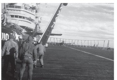 One of VF-191s Panthers returns to the USS Princeton with battle damage which - photo 6