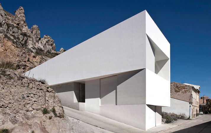 From outside the house looks like a wedge sunk into the rocky hillside Inside - photo 7