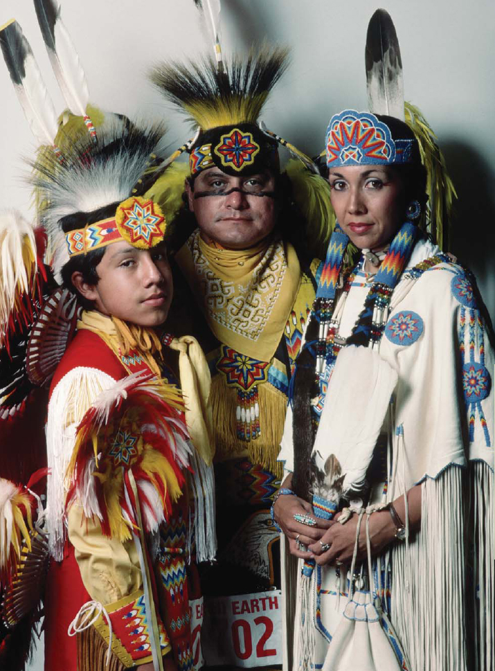 This Native American family is dressed in traditional clothing called regalia - photo 5