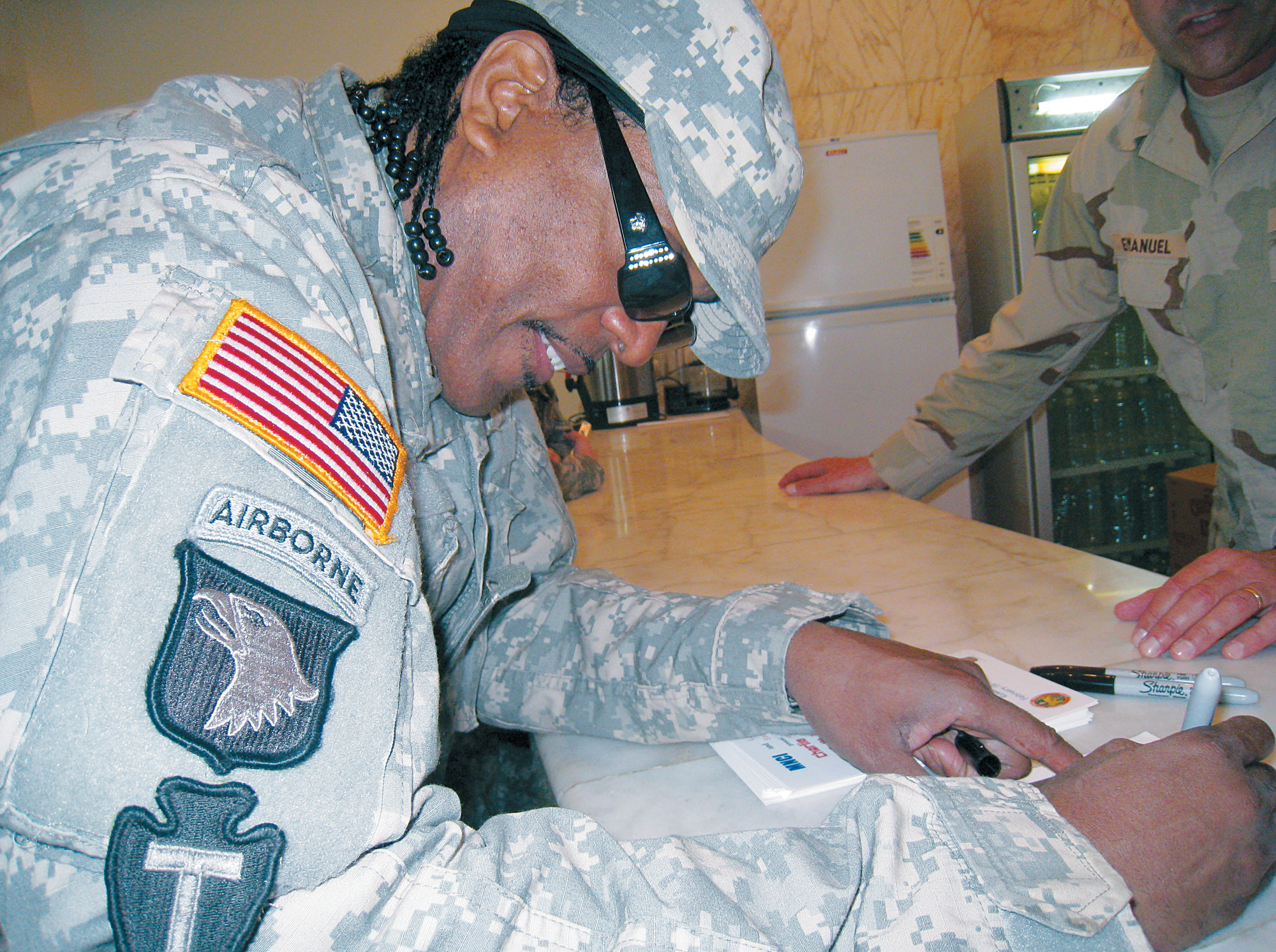 Signing autographs for the US troops after my performance in Iraq in 2009 P - photo 27