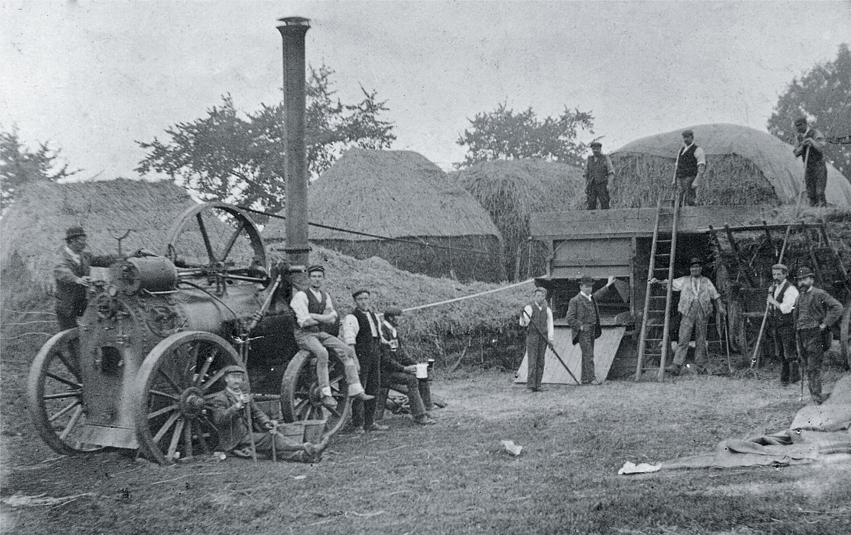 A threshing machine driven by a portable engine in use in a Northamptonshire - photo 5