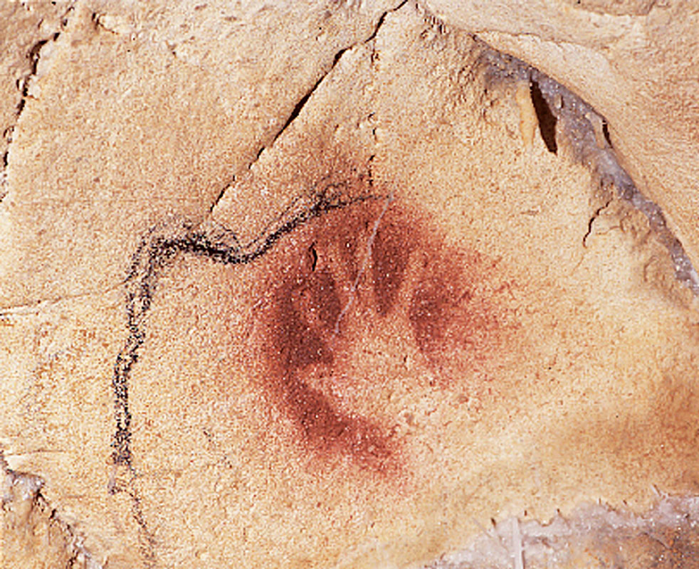 1 A human handprint made about 30000 years ago on the wall of the - photo 3