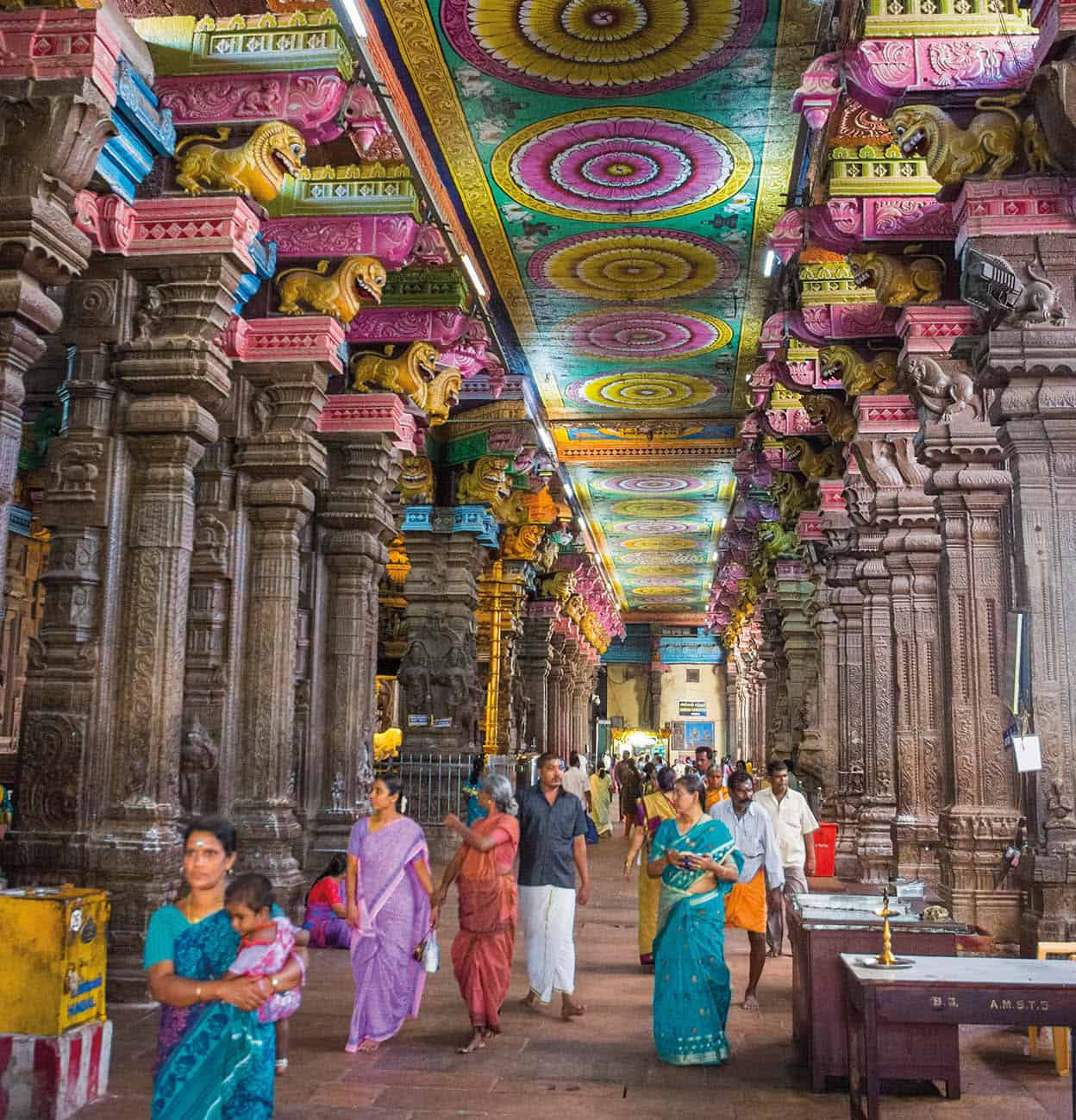 Madurai The great gopuras gateway towers of the Minaksi Temple loom over t - photo 4