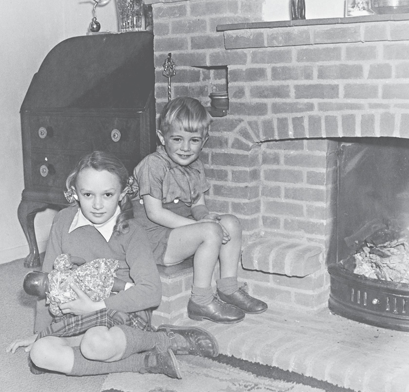 3 My sister Angela with her younger brother and the brick inglenook - photo 3