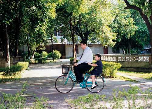 Cycling with his daughter Mingze in Fuzhou City Fujian Province With his - photo 16