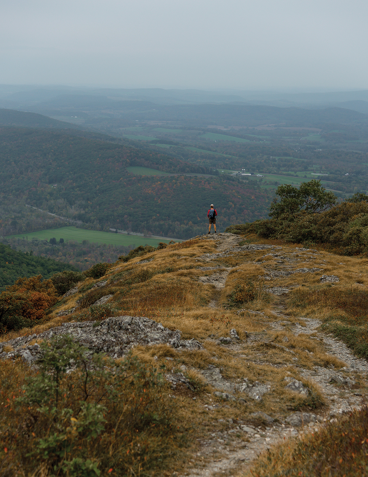 A HIKER ENJOYS THE VIEW FROM ALANDER MOUNTAIN - photo 4