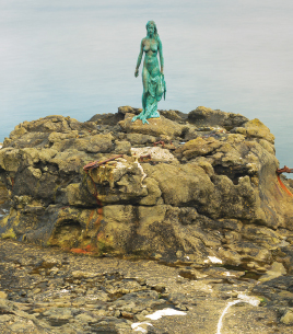 Hans Pauli Olsens sculpture of the seal woman stands 25m tall on the rocky - photo 38