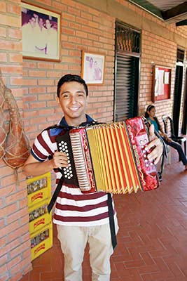 young Colombian musician golden tanager Where to Go Bogot Against the - photo 15