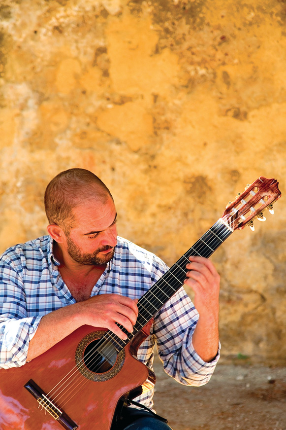 Fado music the soulful heartbeat of Portugal is usually performed by a singer - photo 13