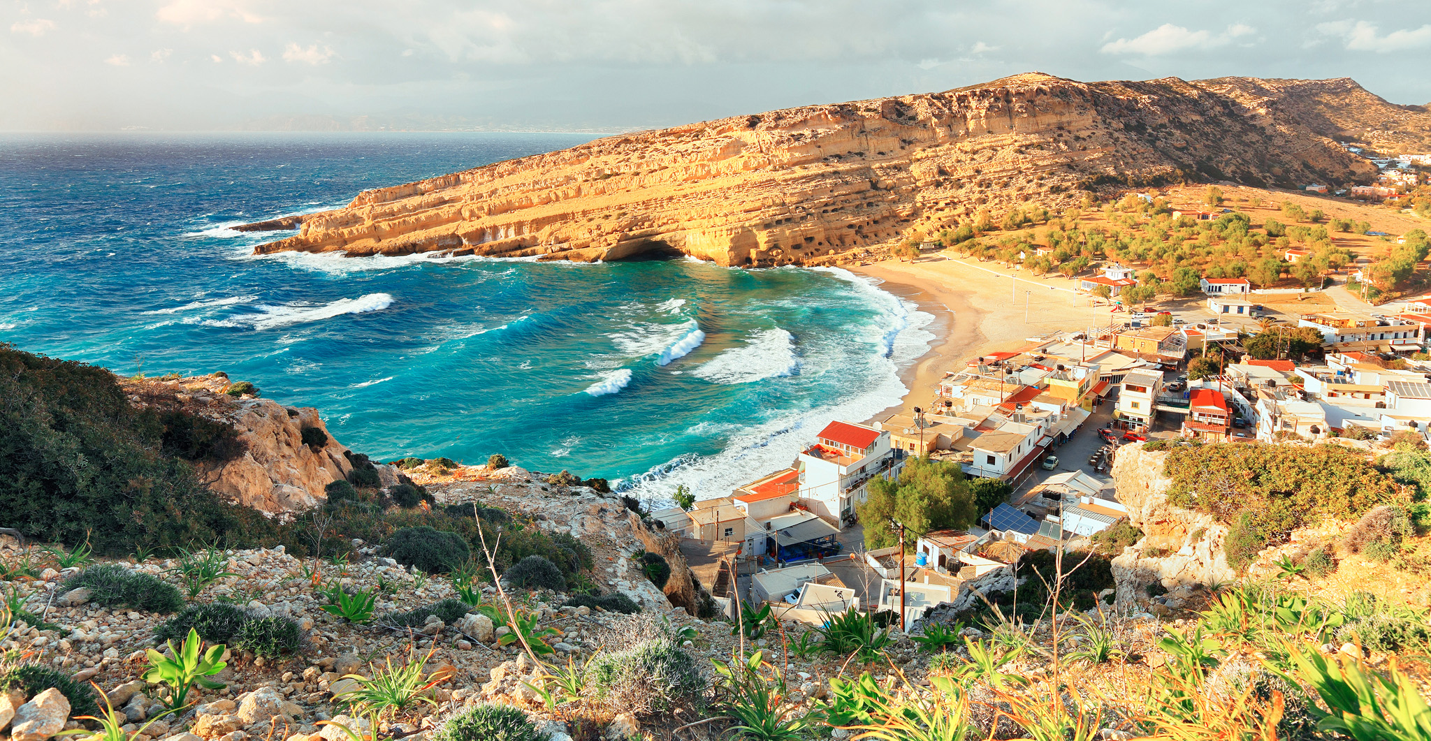 The beach at Matala on Cretes southern coast is sheltered by red cliffs - photo 14