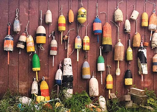 lobster buoys decorate a wall in Bar Harbor Beyond Mount Desert Island other - photo 13