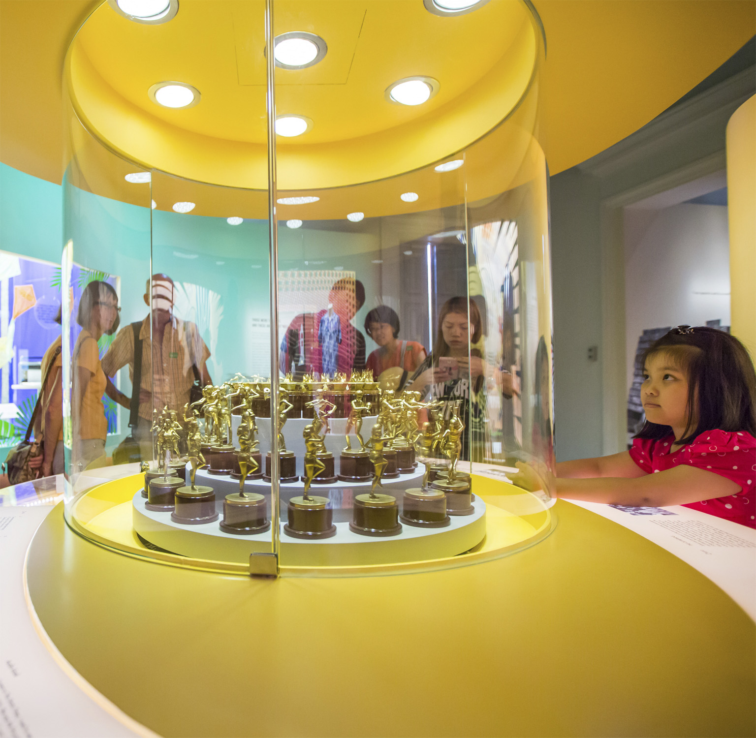 A child keenly looking at an installation at the Growing Up Gallery Gallery - photo 18