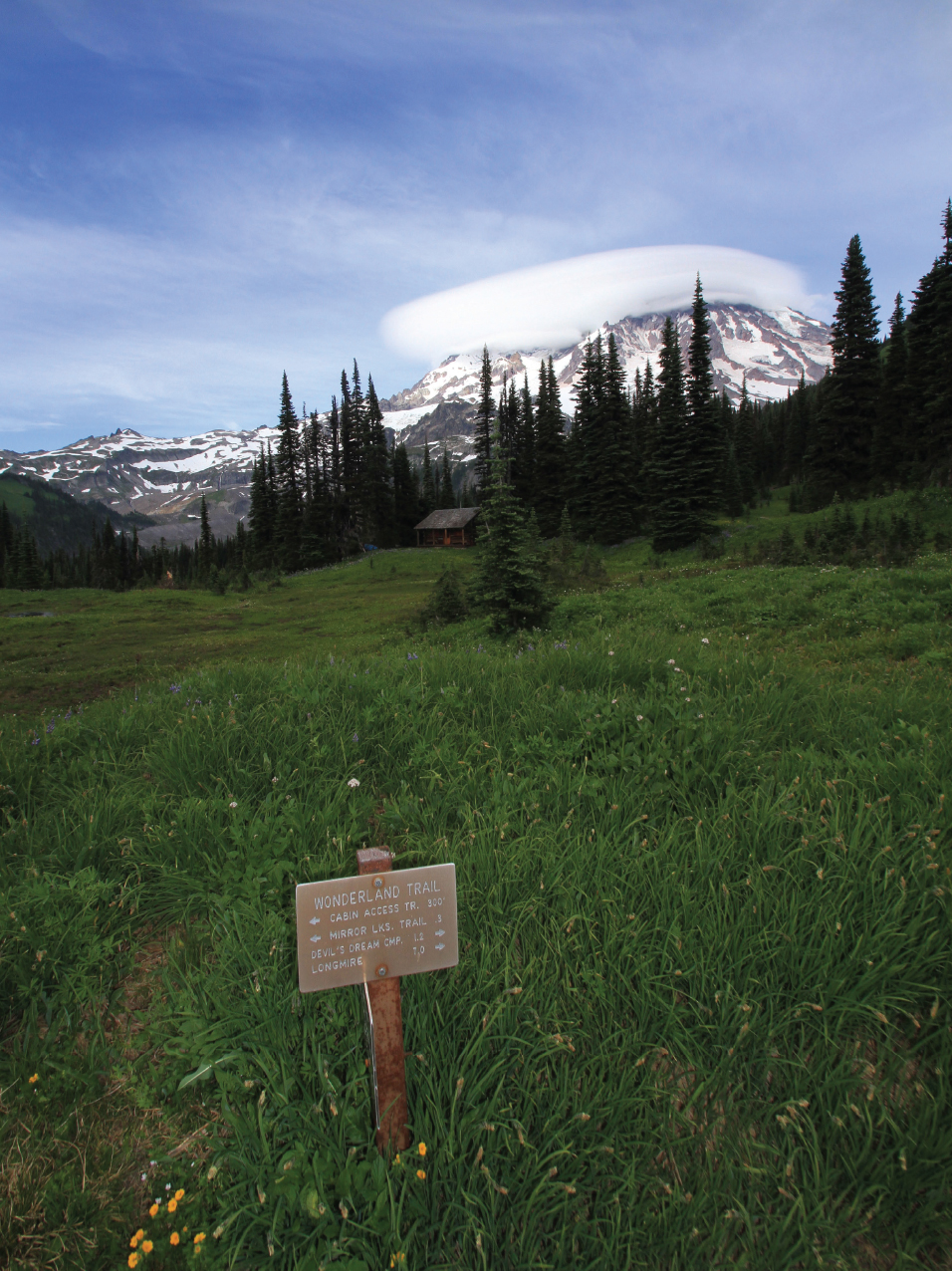 A park sign near Indian Henrys Hunting Ground points travelers in various - photo 7