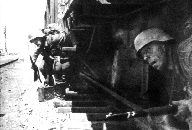 German assault troops here emerging from beneath railroad cars to attack the - photo 9