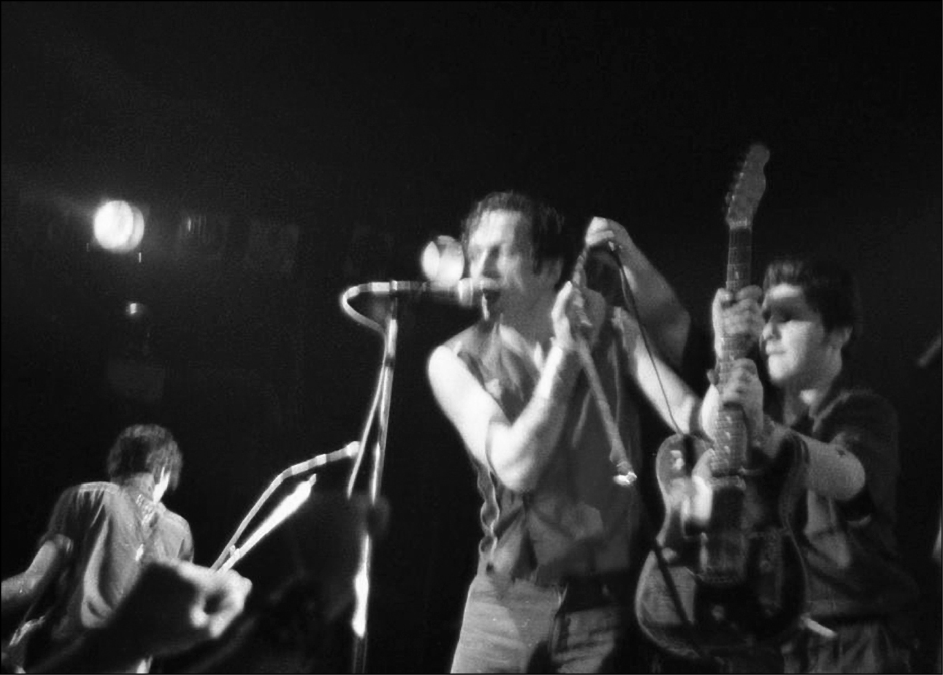 The Baker in action handing a restrung guitar to Joe Strummer midsong - photo 2