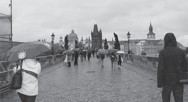 The view down Charles Bridge in Prague Built starting in 1357 it was the only - photo 5