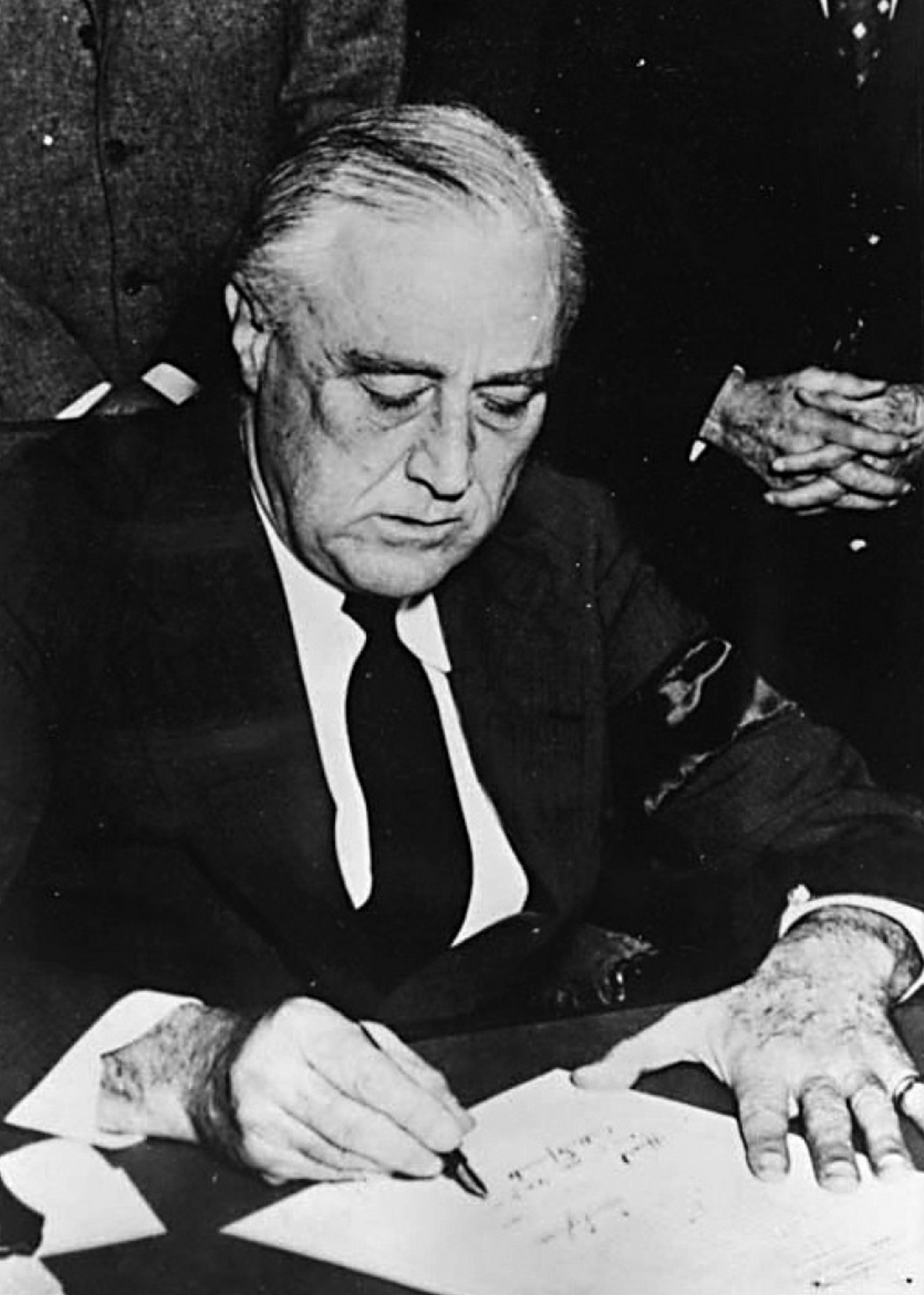 FDR signs the declaration of war against Japan at the White House December 8 - photo 12