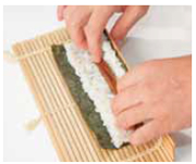 Making sure not to shift the nori lift up the front of the sushi mat and curl - photo 4
