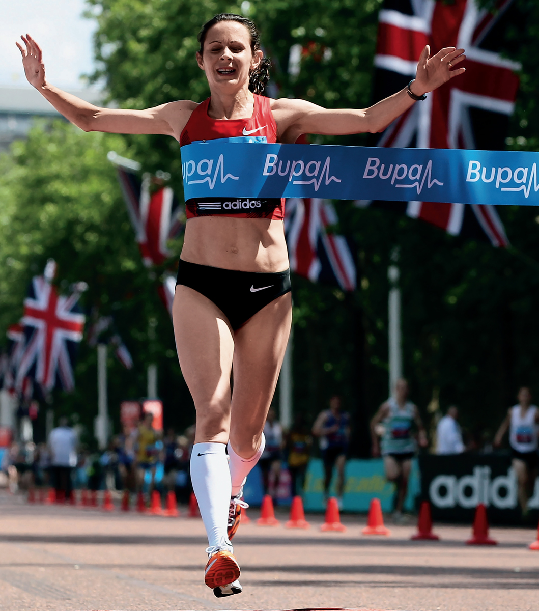 Jo Pavey crosses the line to win the Womens Bupa London 10000m run in 2011 - photo 4