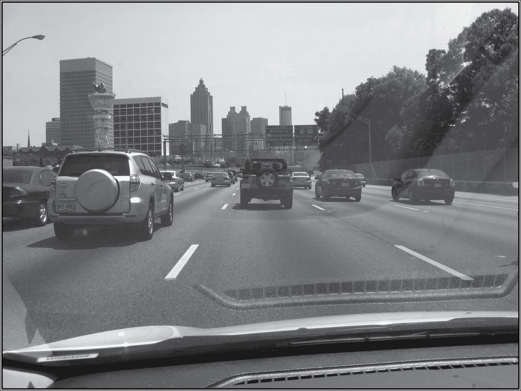 These two photosof traffic on I-7585 and bikers on the BeltLinerepresent two - photo 2