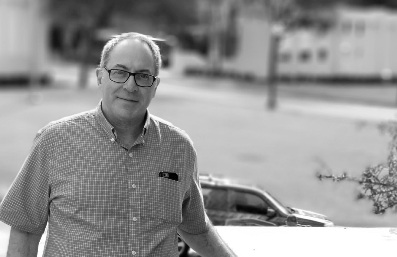 Fred in Dealey Plaza standing next to the pedestal where Abraham Zapruder shot - photo 1