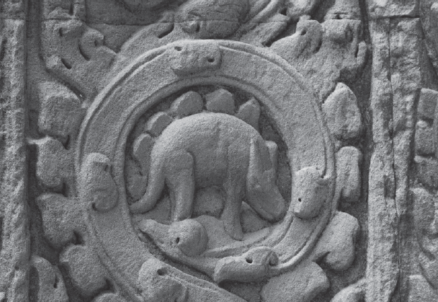 Carvings from Ta Prohm temple in Cambodia built in 1186 The figure looks - photo 4