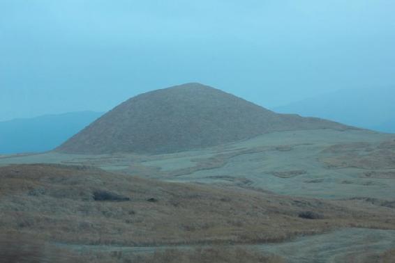 The volcano dominates everything One smaller cone pokes out of the grasslands - photo 2