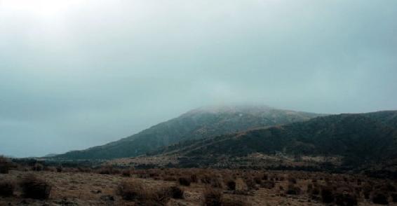 Across the plains of rough brush the peaks disappear into the fog and smoke - photo 5