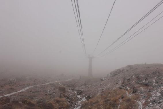 Starting up the mountain the ropeway passed above a rocky landscape into the - photo 11