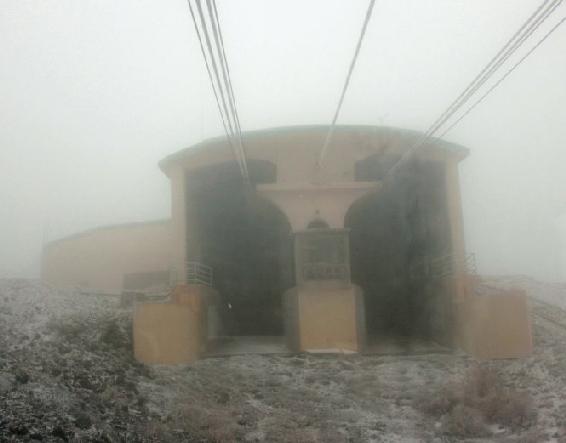 At the top the final station poked through the mist the cables vanishing - photo 14