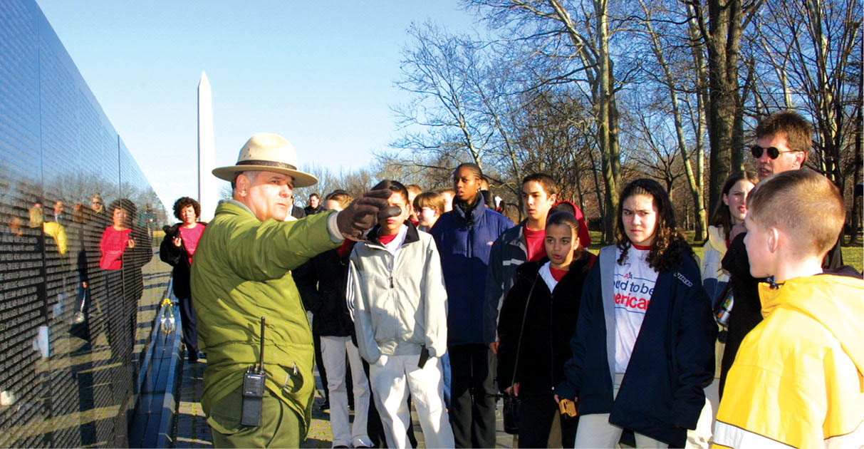 A National Parks ranger leads a guided tour of the Vietnam Veterans Memorial - photo 13