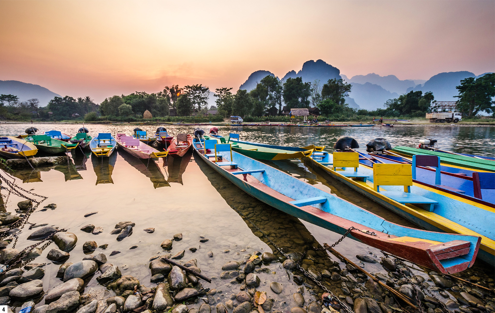 t Boats moored on the river at sunset in Vang Vieng Cambodia and Laos have it - photo 5