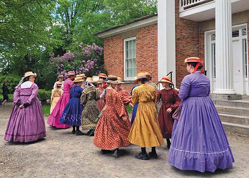 historic interpreters dressed as pioneers at Upper Canada Village In central - photo 11