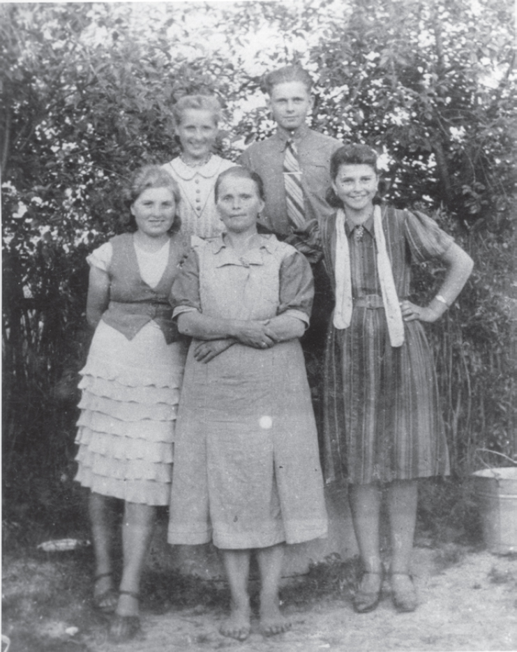 A barefoot Mrs Helena Pejzak front centre daughter Genia on her left son - photo 2