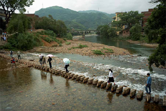 Step-on block bridges where each stone is carved into a similar shape and - photo 3