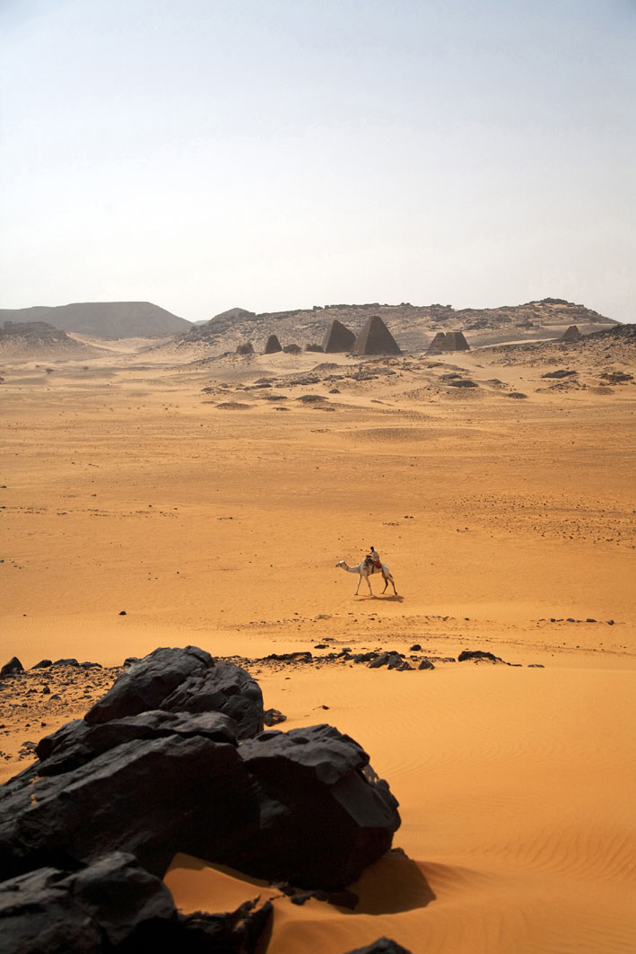 Begrawiya Sudan A rider steers his camel past the ancient Meroe Royal - photo 10