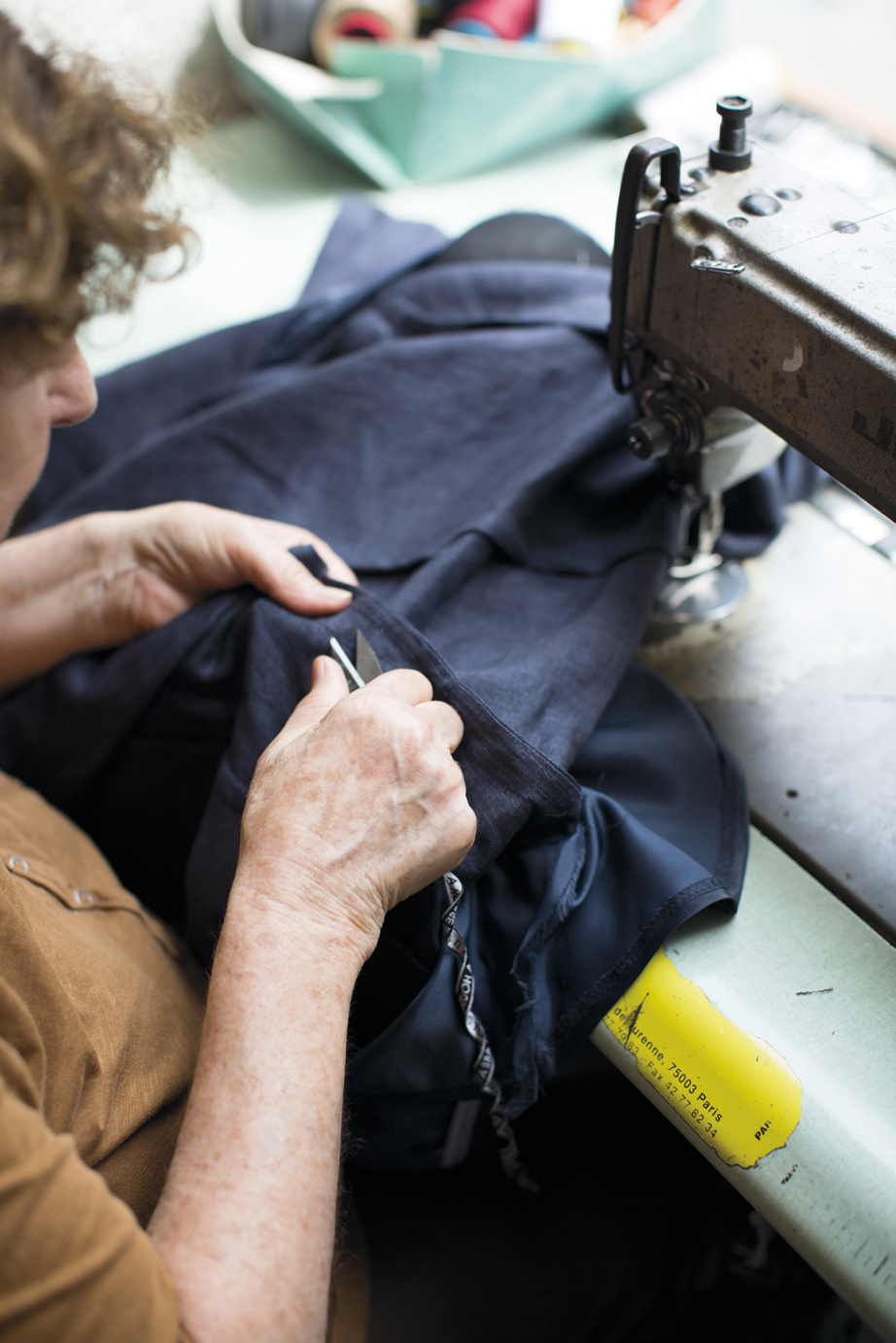 At 69 rue de la Turenne Liliane Slama sits at her sewing machine stitching - photo 8