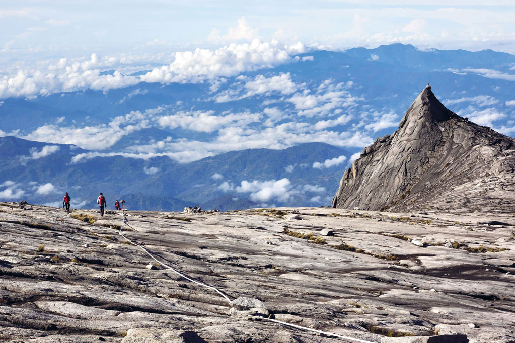 Rmnunes Getty hikers at the top of Mt Kinabalu in Borneo Justin Foulkes - photo 3