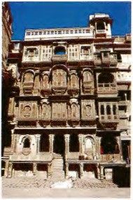 The stone faades of havelis in Rajasthan Ornate jharokhas balconies with - photo 2