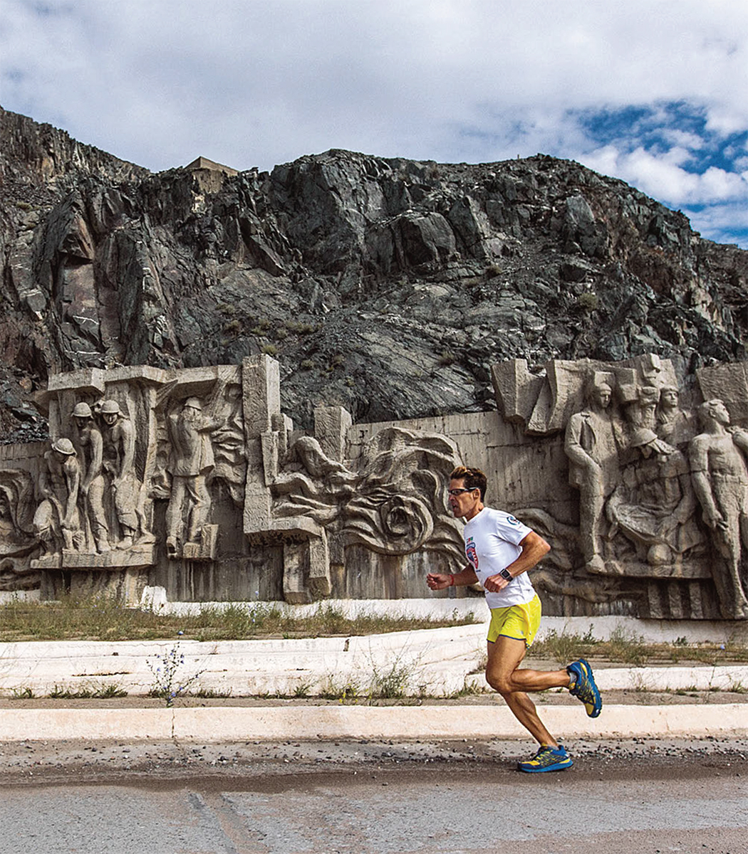 Dean Karnazes passes a Soviet relief mural in Talas Kyrgyzstan as part of his - photo 4