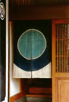 Tie-dyed indigo noren hanging in the doorway of the Kakinoki antique shop in - photo 9