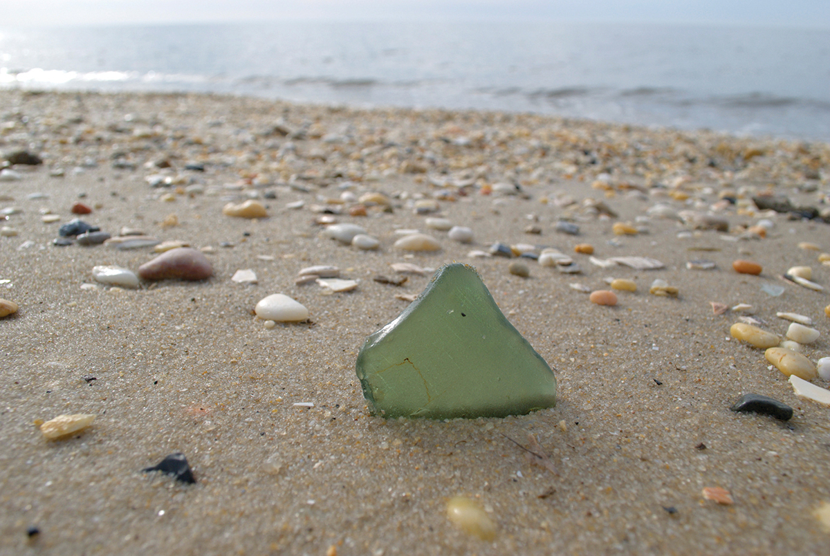 Icy-looking sea glass on a warm beach - photo 26