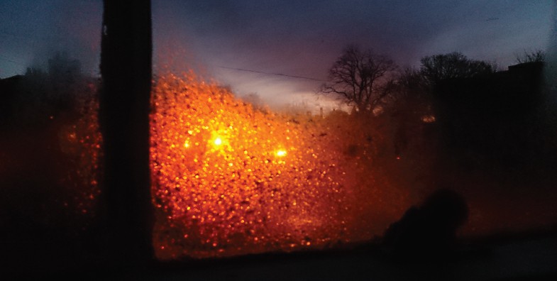 Condensation on my window lit by the sodium street lights outside my flat - photo 3