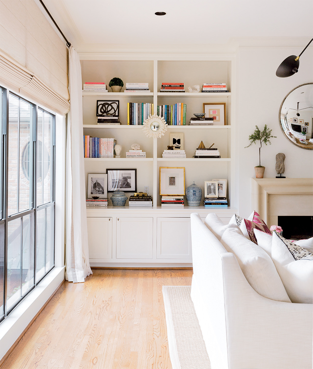 Crisp white walls tall ceilings and details abound in this airy living room - photo 8